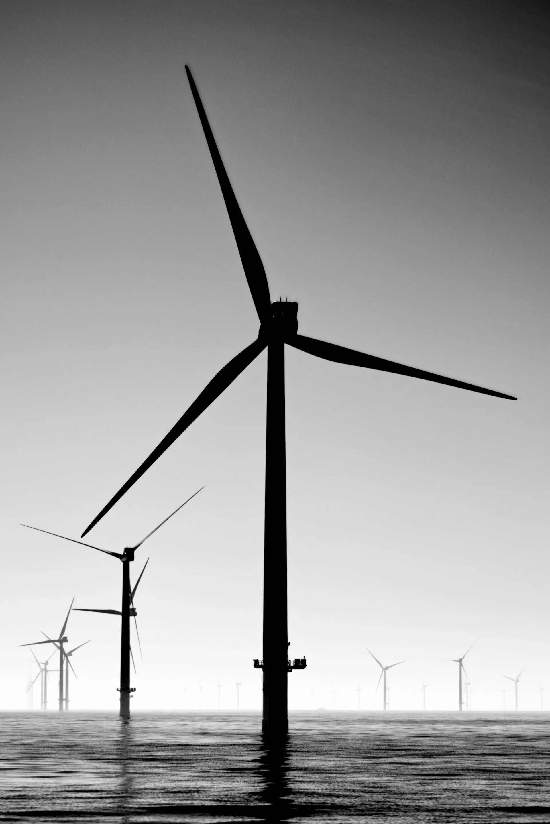 Wind turbines against a sky background
